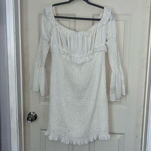 White smocked dress with bell sleeves